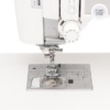 Close-up of the Janome MC6700P advanced AcuFeed Flex layered fabric feeding system handling thick quilt layers near Raleigh, NC.