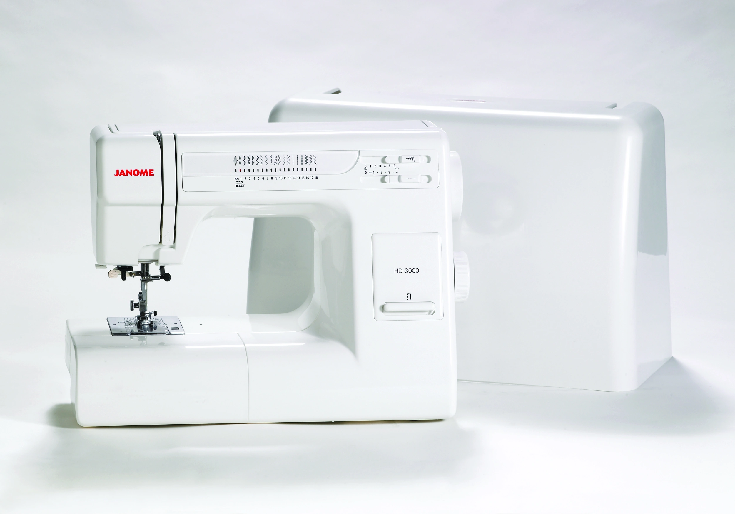 Janome HD-3000 heavy-duty mechanical sewing machine shown with its included protective hard shell carrying case near Wake Forest, NC.