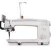Janome Quilt Maker Pro 20 longarm quilting machine with a spacious 20-inch arm workspace on display at The Broken Needle in Bunn, NC.