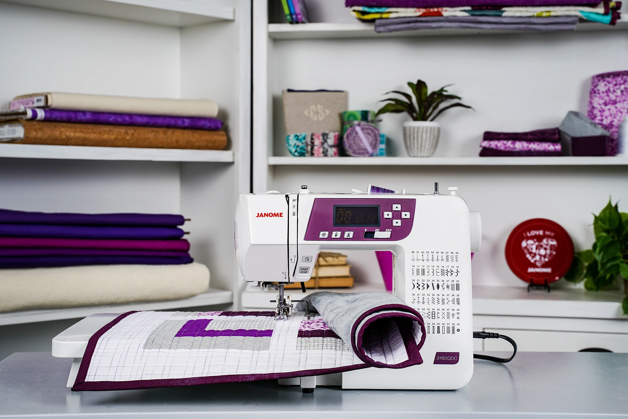 • Janome 3160QDC-G wide extension table attachment setup configured for large quilting projects serving Wilmington and Coastal NC.