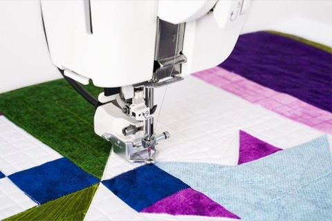 Janome CM8 Accurate Stitch Regulator system providing automated stitch regulation during free-motion quilting serving Wilmington, NC.