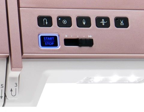 Close-up of the Janome Horizon MC9410QC precision speed control slider and automatic thread cutter panel near Raleigh, NC.