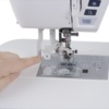 Janome Skyline 7 built-in one-handed Superior Needle Threader mechanism close-up near Clay ton, NC.