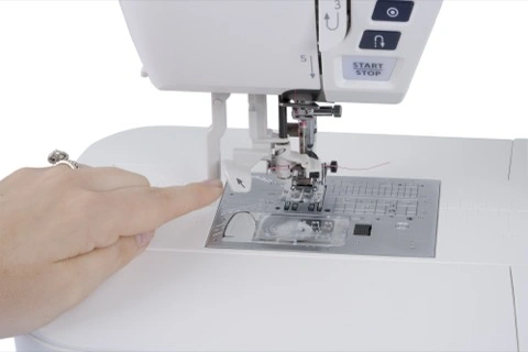 Janome Skyline 7 built-in one-handed Superior Needle Threader mechanism close-up near Clay ton, NC.