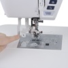 Close-up of the Janome Skyline S6 built-in advanced one-hand needle threader serving Wilmington and Coastal NC.