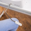 Close-up of the Janome Skyline S7 ergonomic hands-free knee lift lever accessory serving Wilmington and Coastal NC.