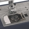 Janome Travel Mate 50 automatic thread cutter button and 7-piece feed dog system serving Clayton, Garner, and Angier, NC.