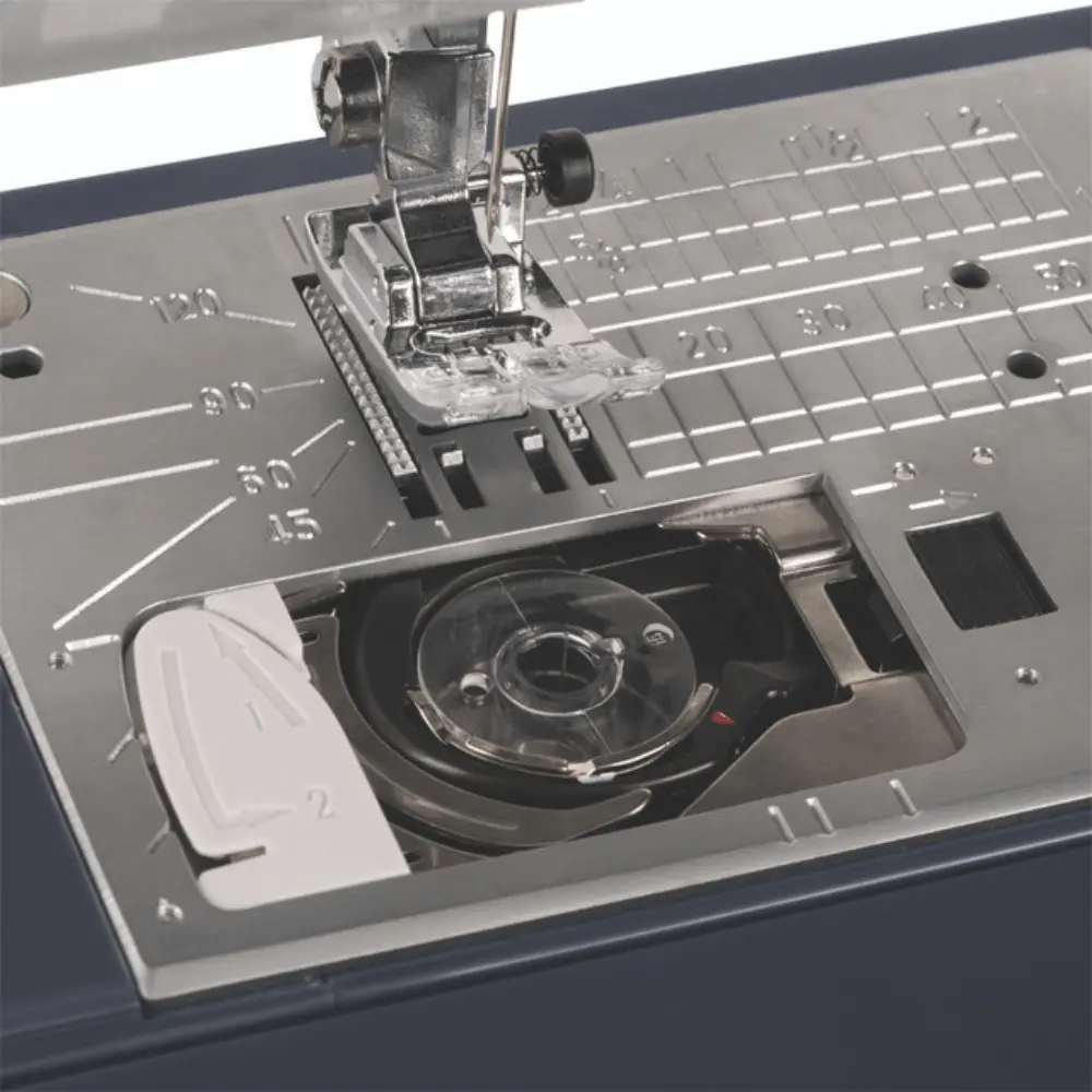 Janome Travel Mate 50 automatic thread cutter button and 7-piece feed dog system serving Clayton, Garner, and Angier, NC.