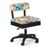 Arrow Sew Wow Sew Now hydraulic sewing chair with dynamic colorful seamstress patterns on display inside the Bunn NC showroom.