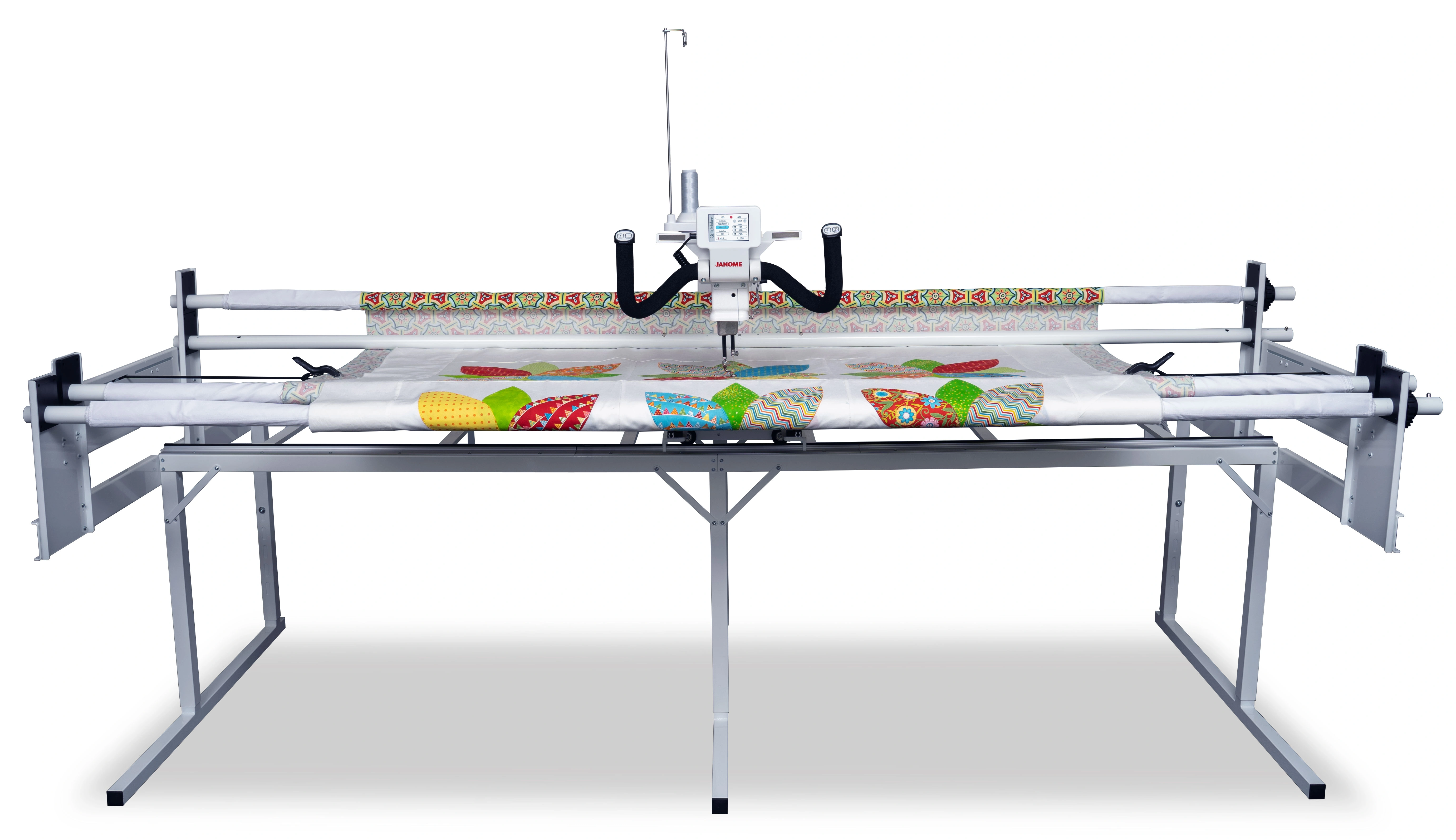 Janome Quilt Maker Pro 18 longarm quilting machine set up on its 12-foot steel frame inside the showroom of The Broken Needle in Bunn, NC.