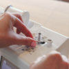 Janome MC100E sewing machine showcasing the built-in USB flash drive port for custom design transfer serving Wilmington and Coastal NC.