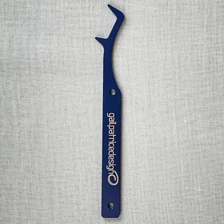 Secure final cover or chain stitches effortlessly with the Locking Fork! This handy tool skillfully grabs needles, minimizing breakage. Made of: Aluminum Use: Securing Serger Stitches Included: Locking Fork, Instruction Kit Size: 4-1/2in x 1in