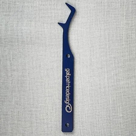 Secure final cover or chain stitches effortlessly with the Locking Fork! This handy tool skillfully grabs needles, minimizing breakage. Made of: Aluminum Use: Securing Serger Stitches Included: Locking Fork, Instruction Kit Size: 4-1/2in x 1in