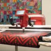 Janome QMP 20 Red precise telescoping thread stand and easy-set manual tension dials serving Clayton, Garner, and Angier, NC.