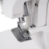 Close-up of the Janome SewSwitch 30 overlock thread tension adjustment dials available for delivery near Danville and Southern VA.