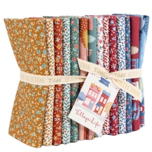 Tilda Fabrics Village Life premium quilting Fat Quarter bundle collection on display at The Broken Needle store serving local North Carolina creators.