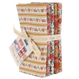 Tilda Fabrics Village Life premium quilting Fat Quarter bundle collection on display at The Broken Needle store serving local North Carolina creators.